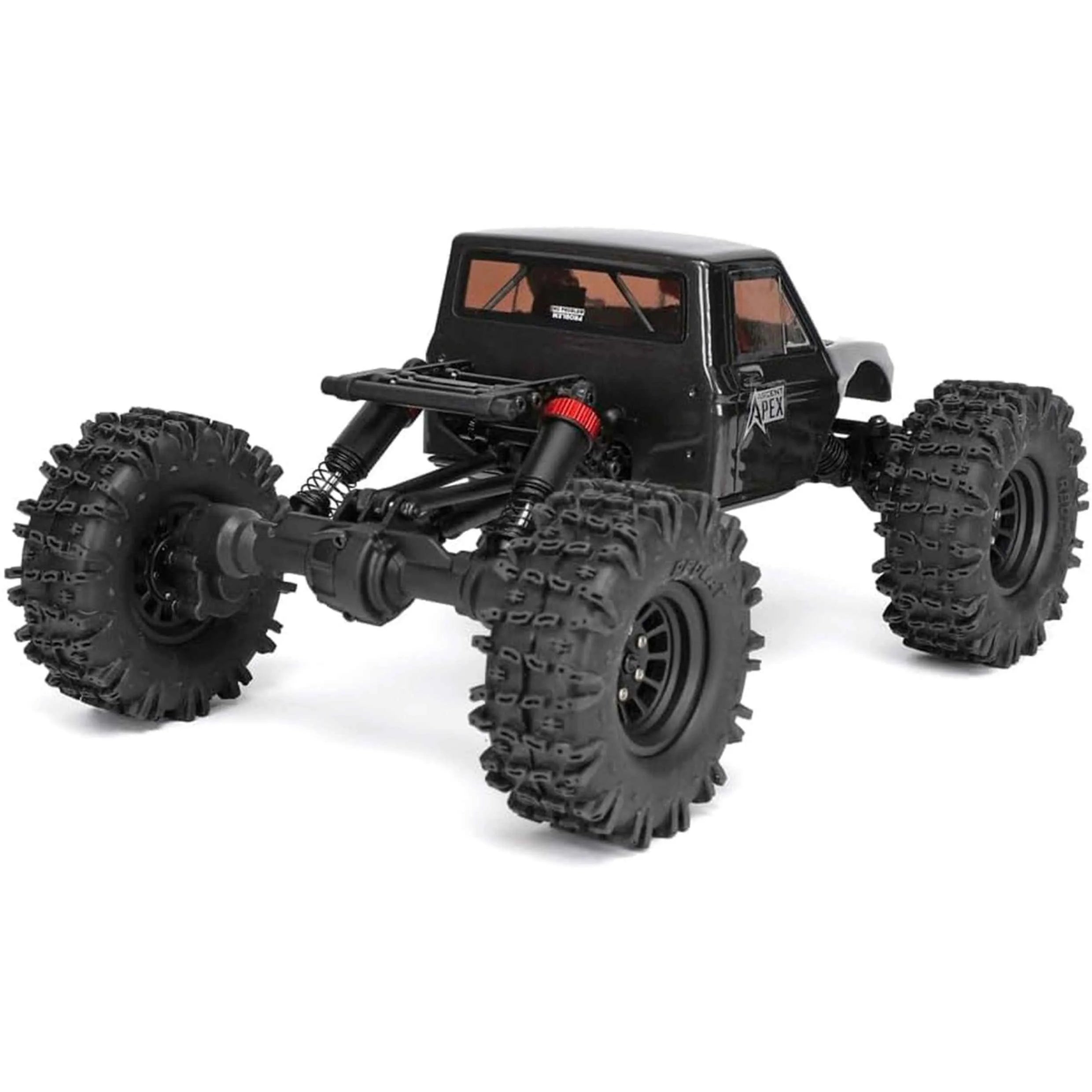Black off-road crawler truck with large tires on a white background