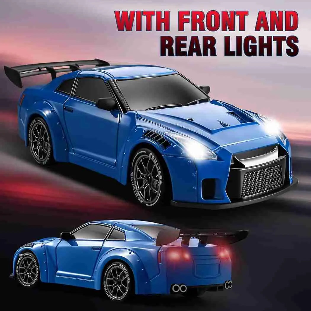Blue rc drift car with front and rear lights on a dark background