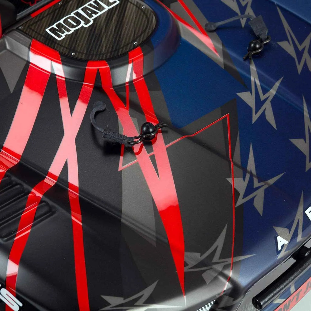 Close-up of a vehicle with red and black design and 'Mojave' branding.