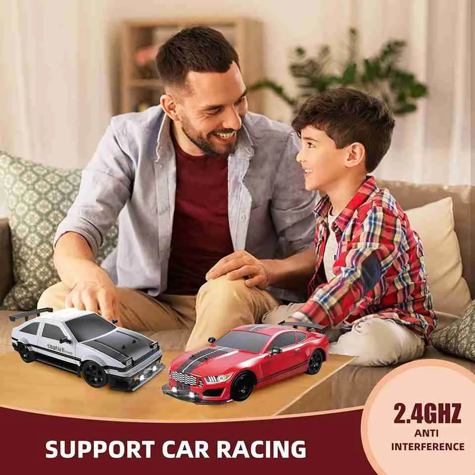 Man and child playing with toy cars on a table in a living room.