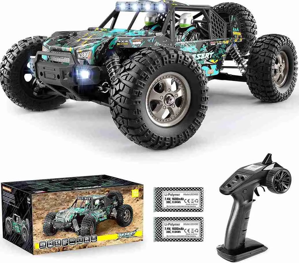 Remote control monster truck with box, batteries, and controller on a white background