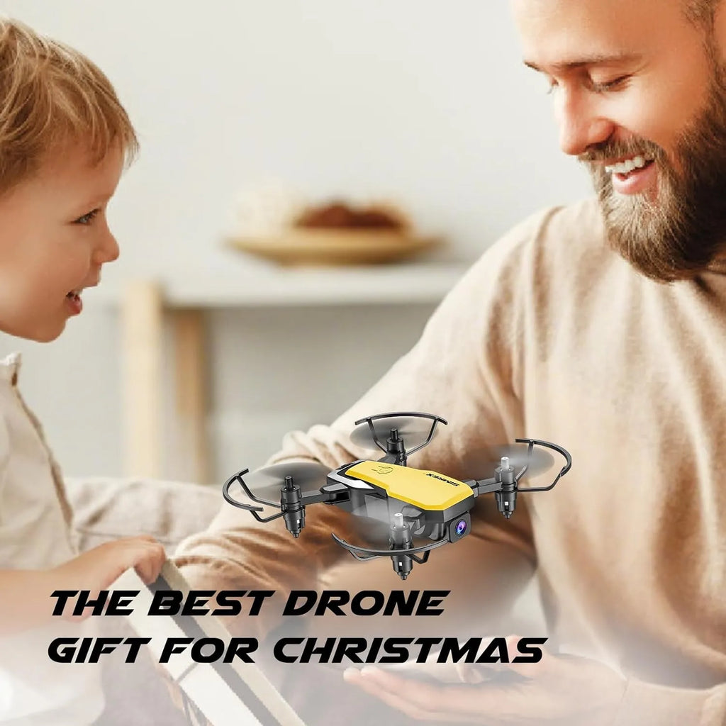 A man and a child looking at a small RC drone with text 'The Best Drone Gift for Christmas'.