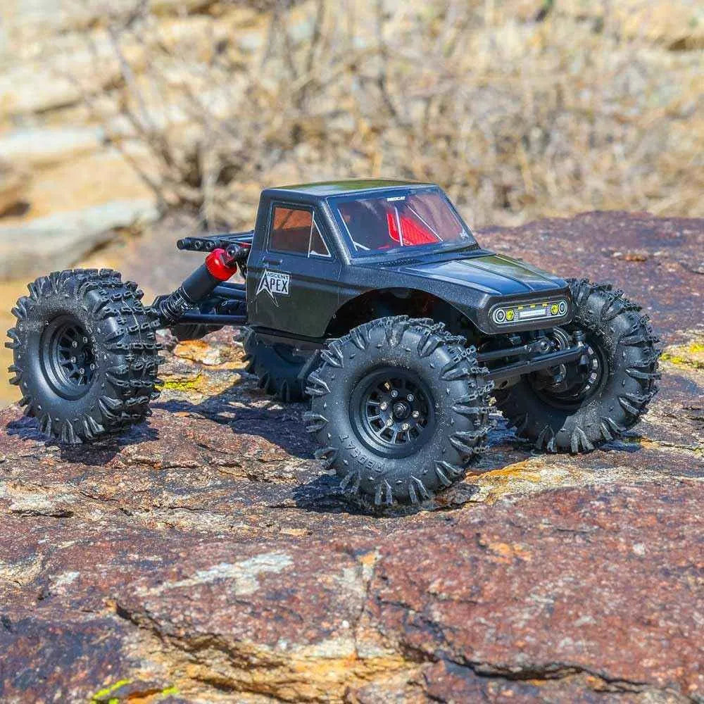Black off-road crawler truck on rocky terrain