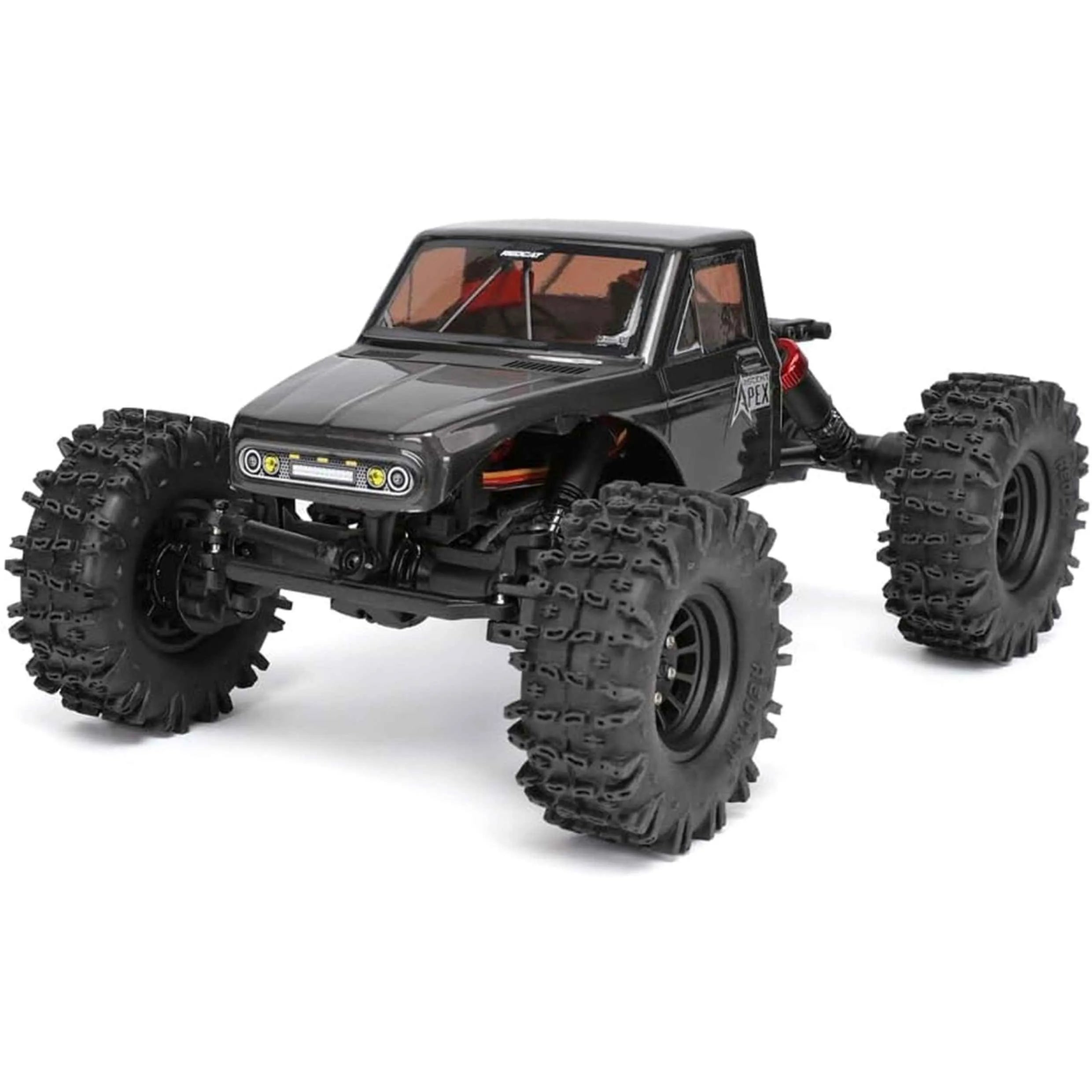 Black off-road crawler vehicle with large tires on a white background