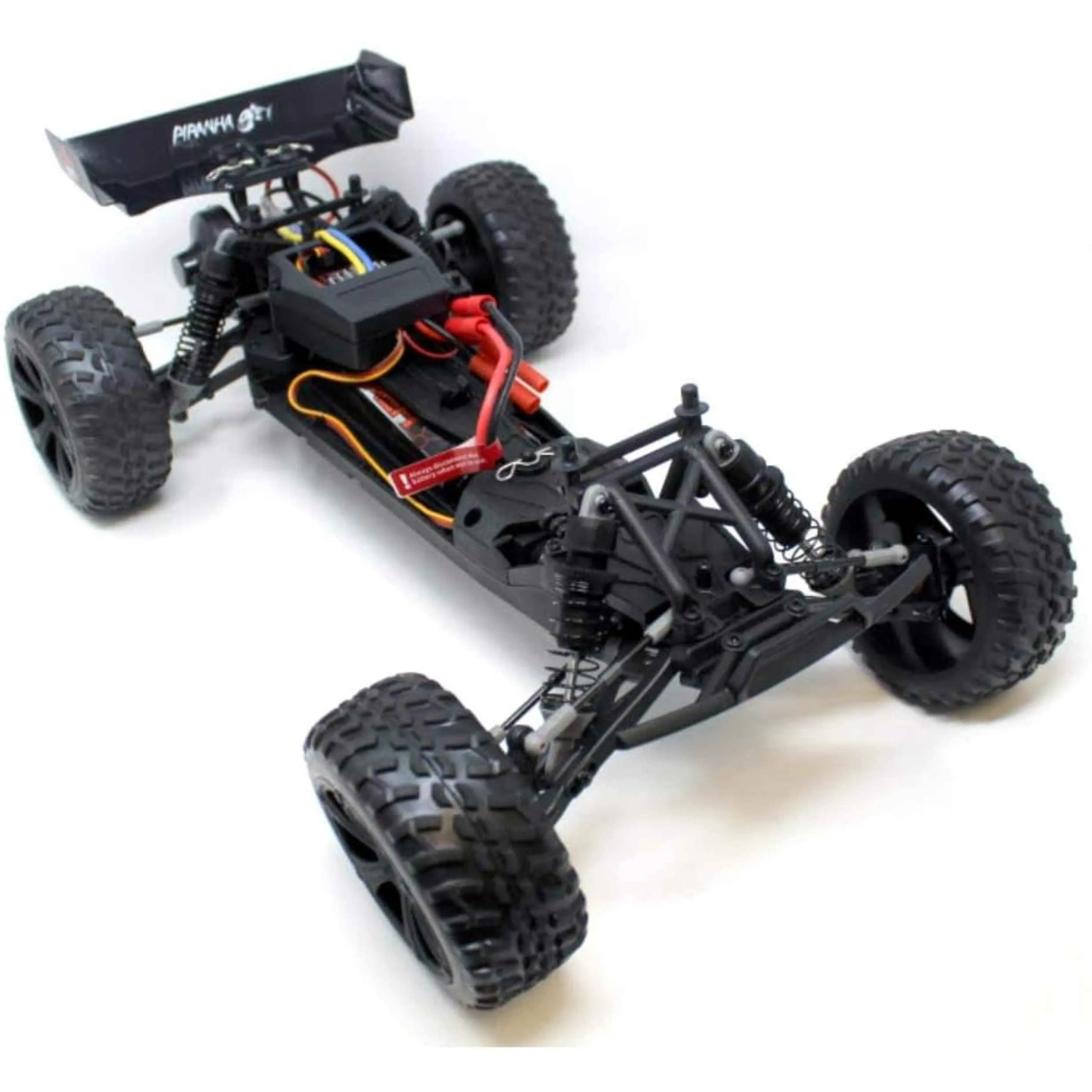 Black off-road RC truggy chassis on a white background