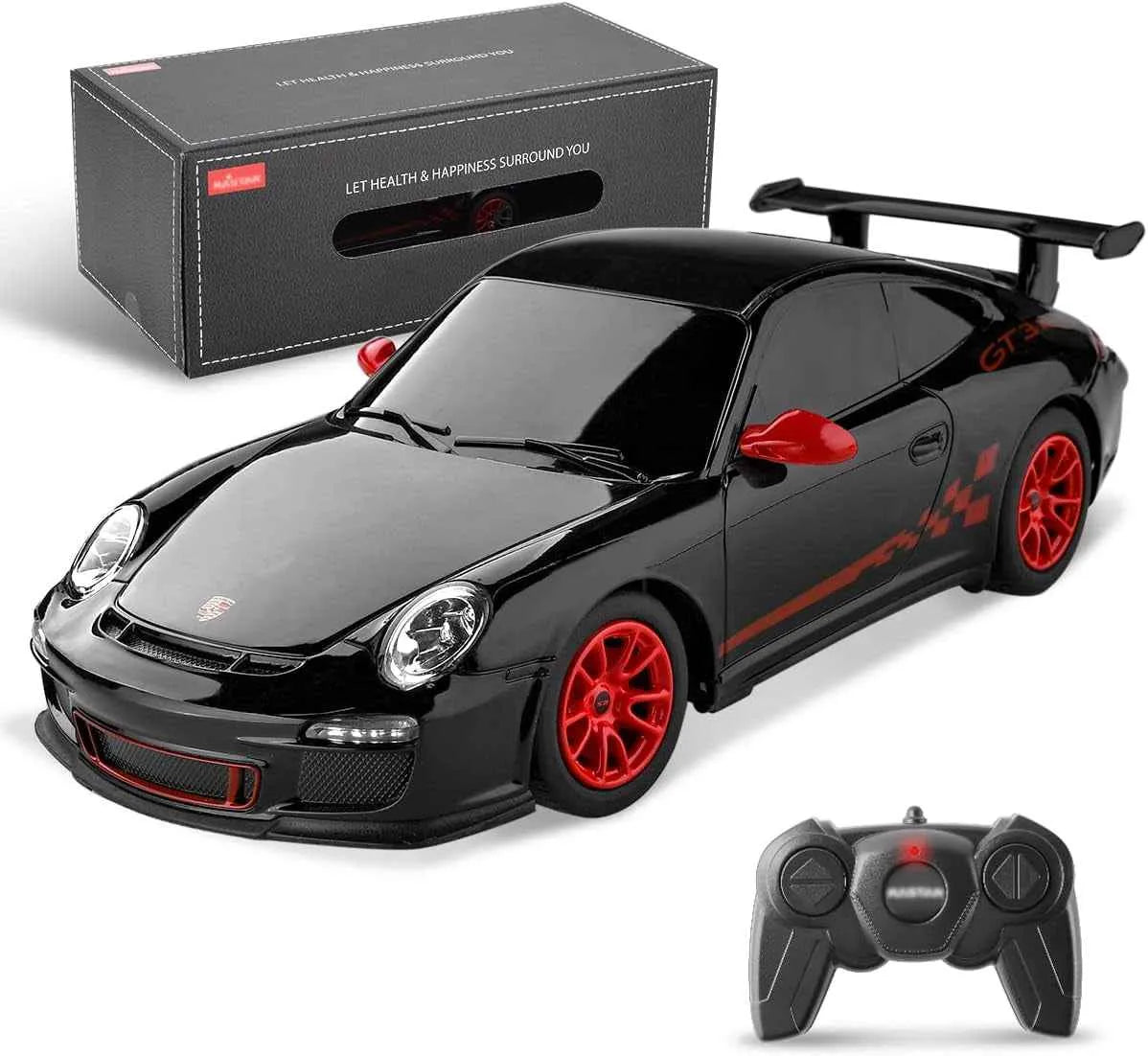 Black RC sports car with red wheels and a remote control in front of its packaging box.
