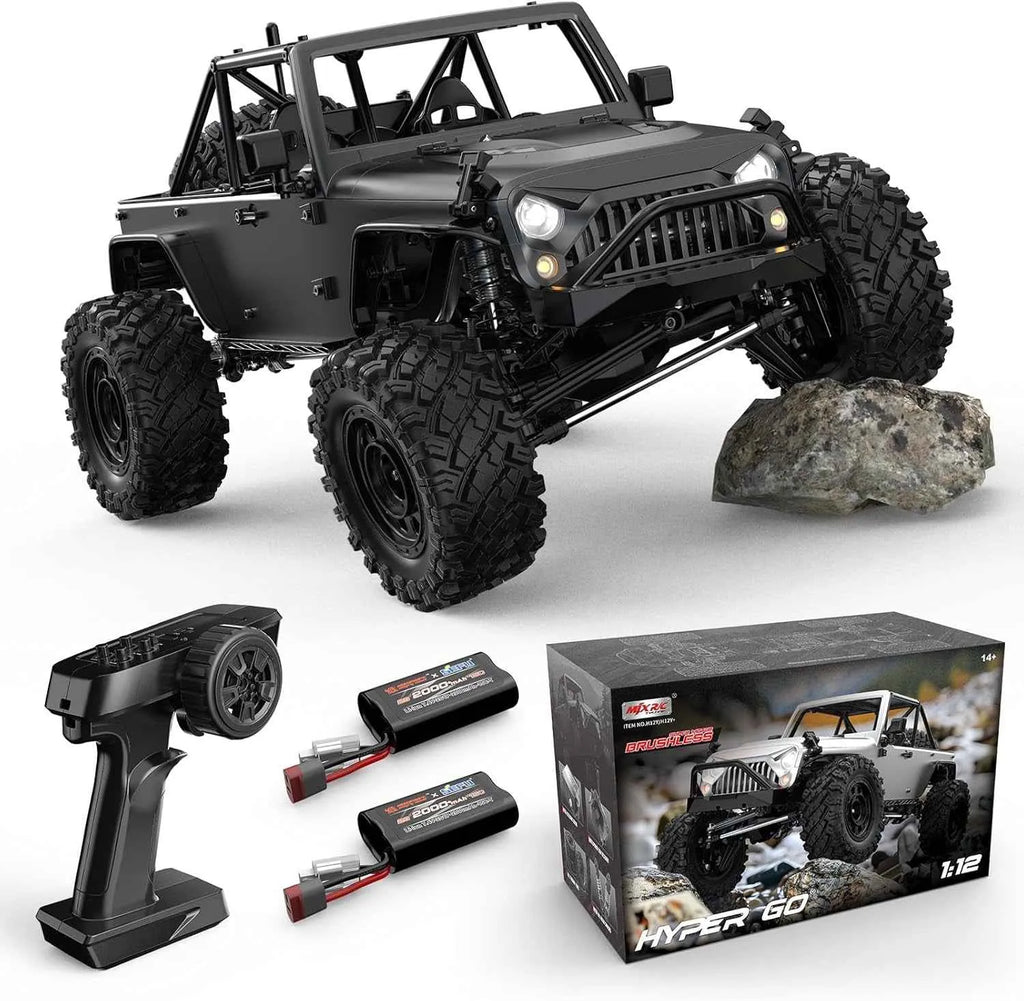 Black remote control off-road crawler with controller, batteries, and packaging on a white background