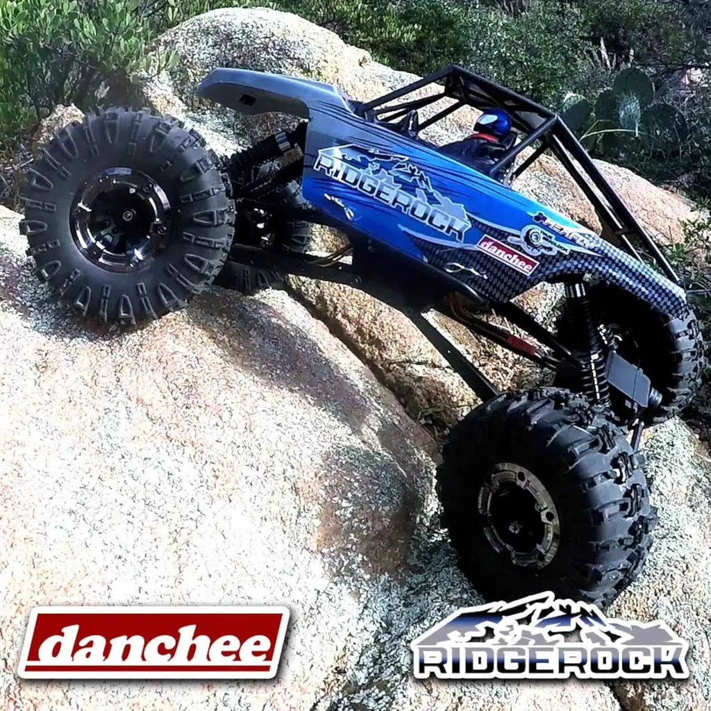 Blue off-road crawler climbing a rock with 'danchee' and 'Ridgerock' branding.