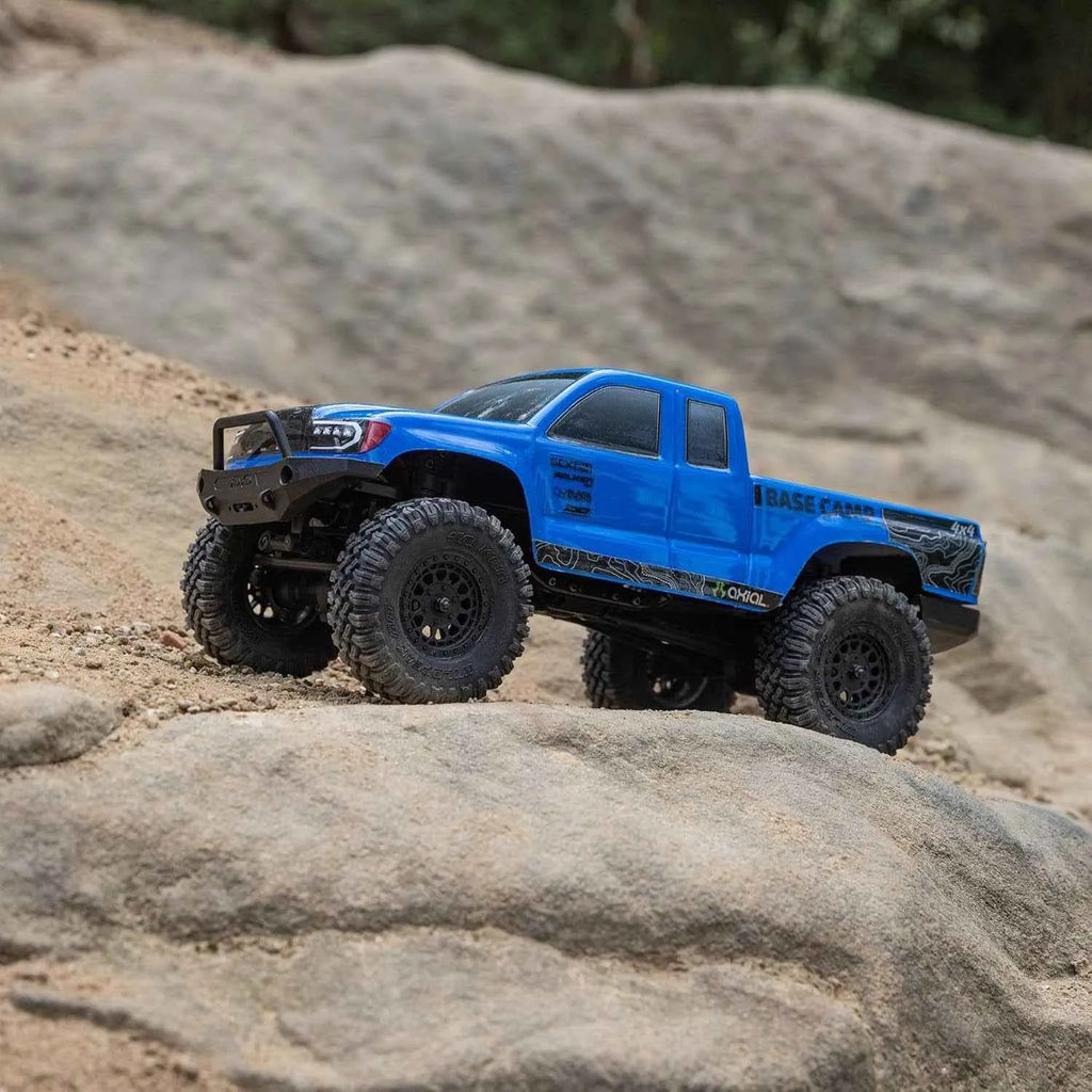 Blue off-road rock crawler on a rocky surface