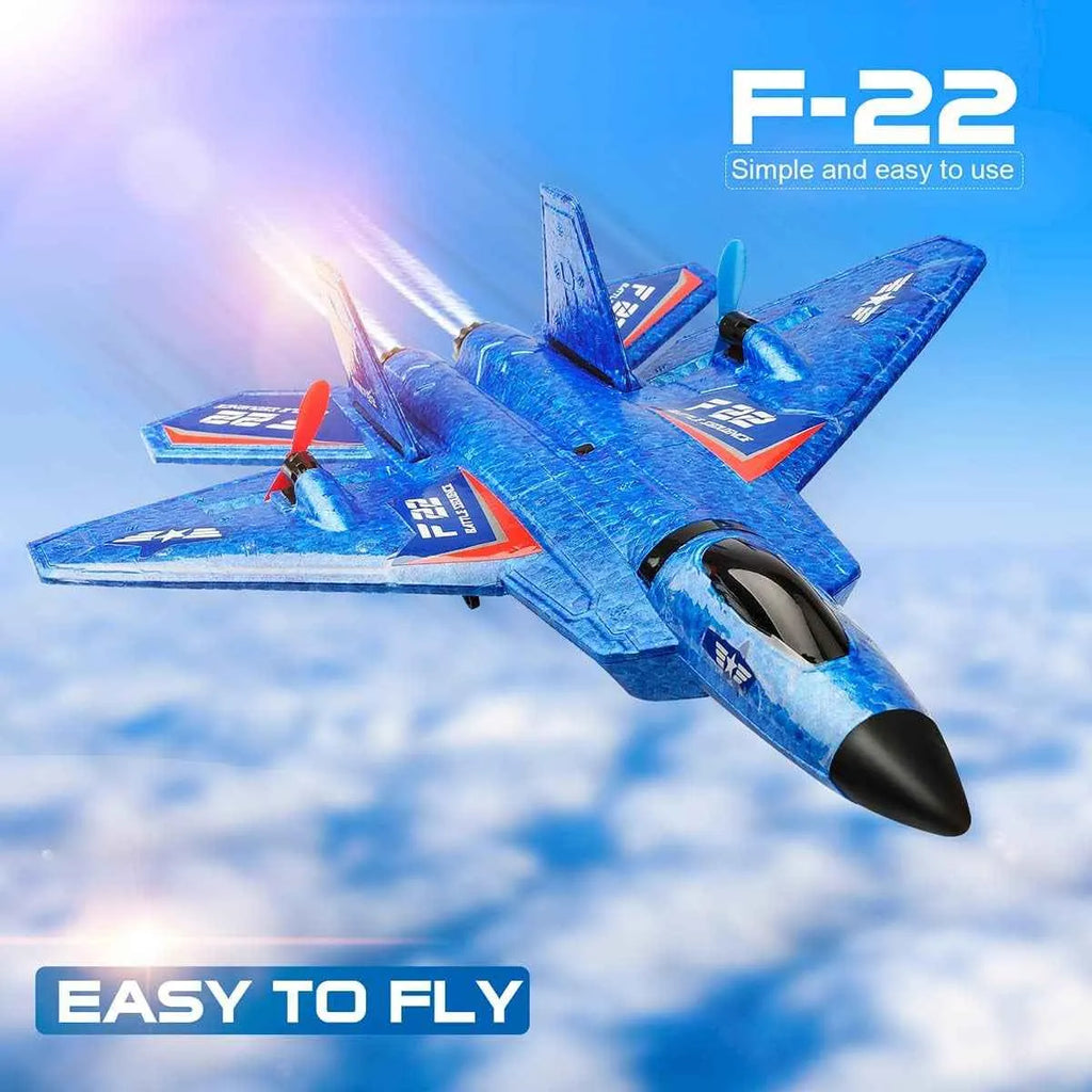 Blue RC airplane with 'F-22' branding against a blue sky background