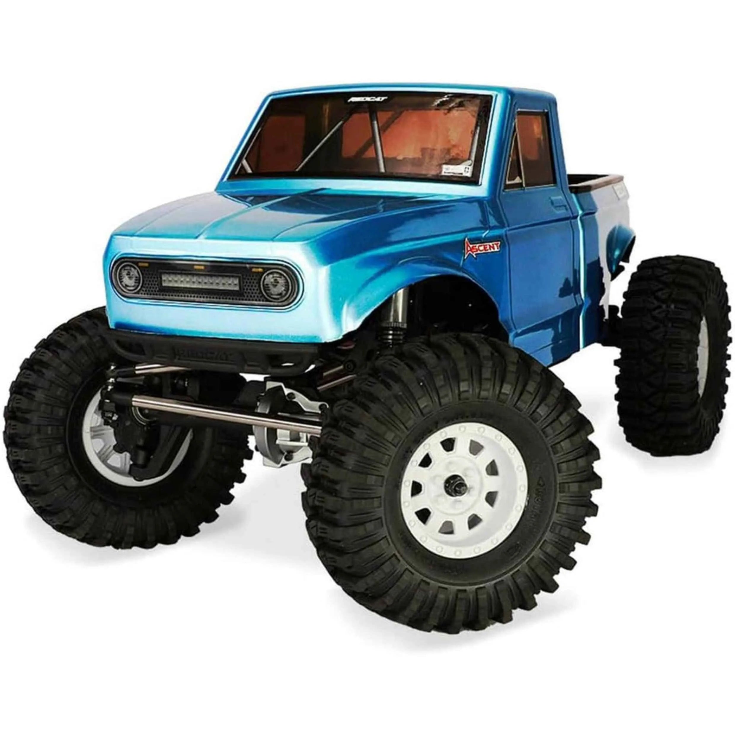 Blue RC crawler with large wheels on a white background