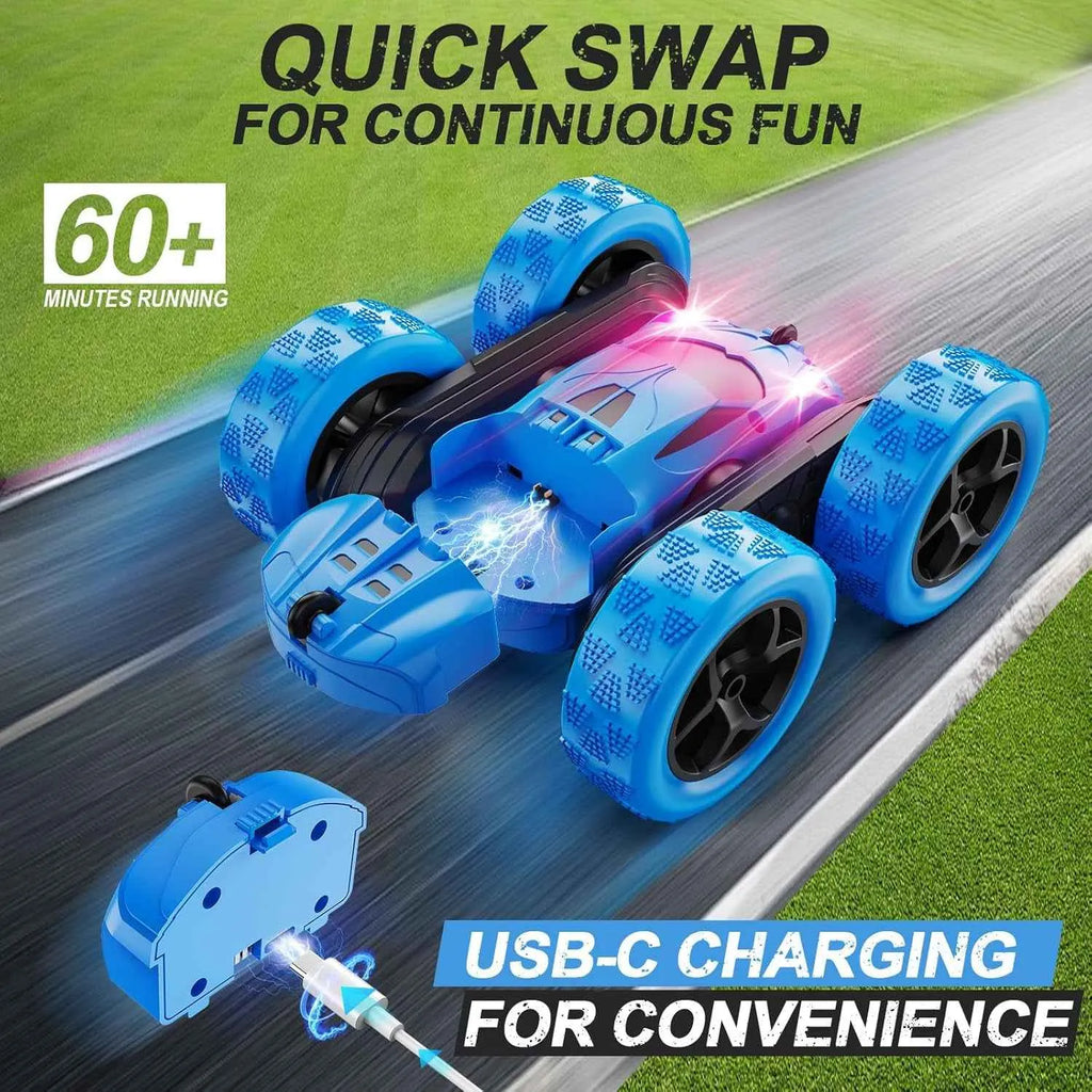 Blue RC stunt car with USB-C charging feature on a road with grass background