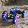 Blue RC stunt car with glowing tyres on an playing terrain.