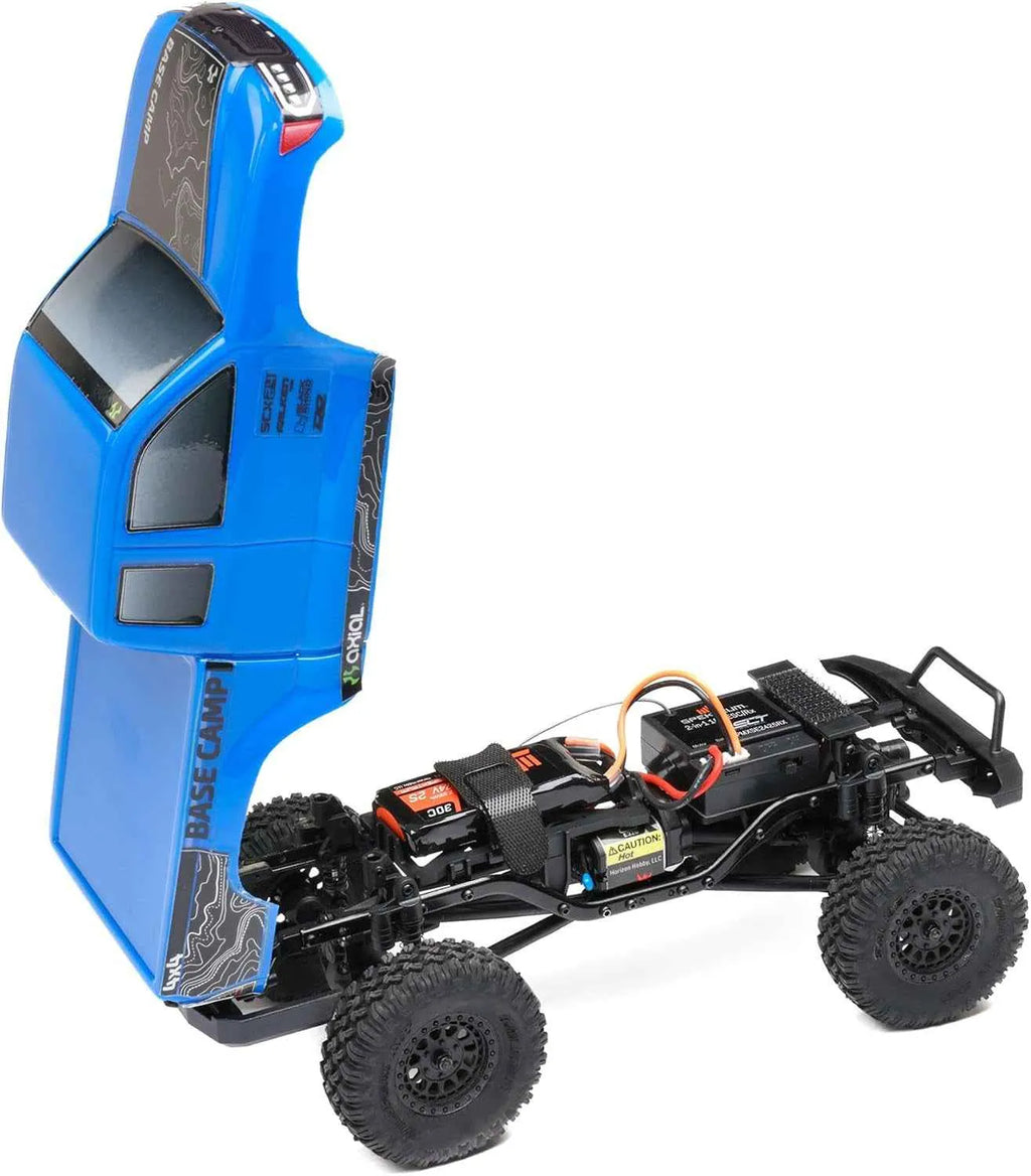 Blue remote control crawler chassis on a white background