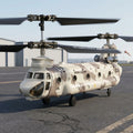 Camouflage RC helicopter model on a tarmac with clear sky