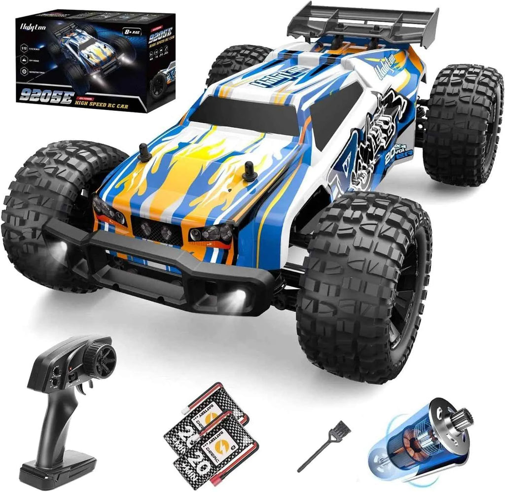 Colorful remote control monster truck with accessories on a white background