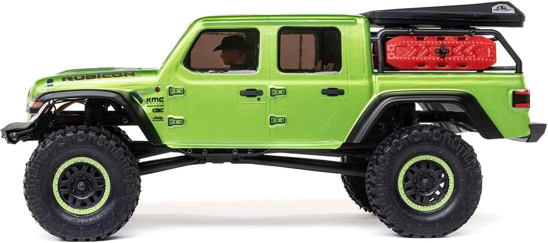 Green off-road RC crawler with large wheels on a white background