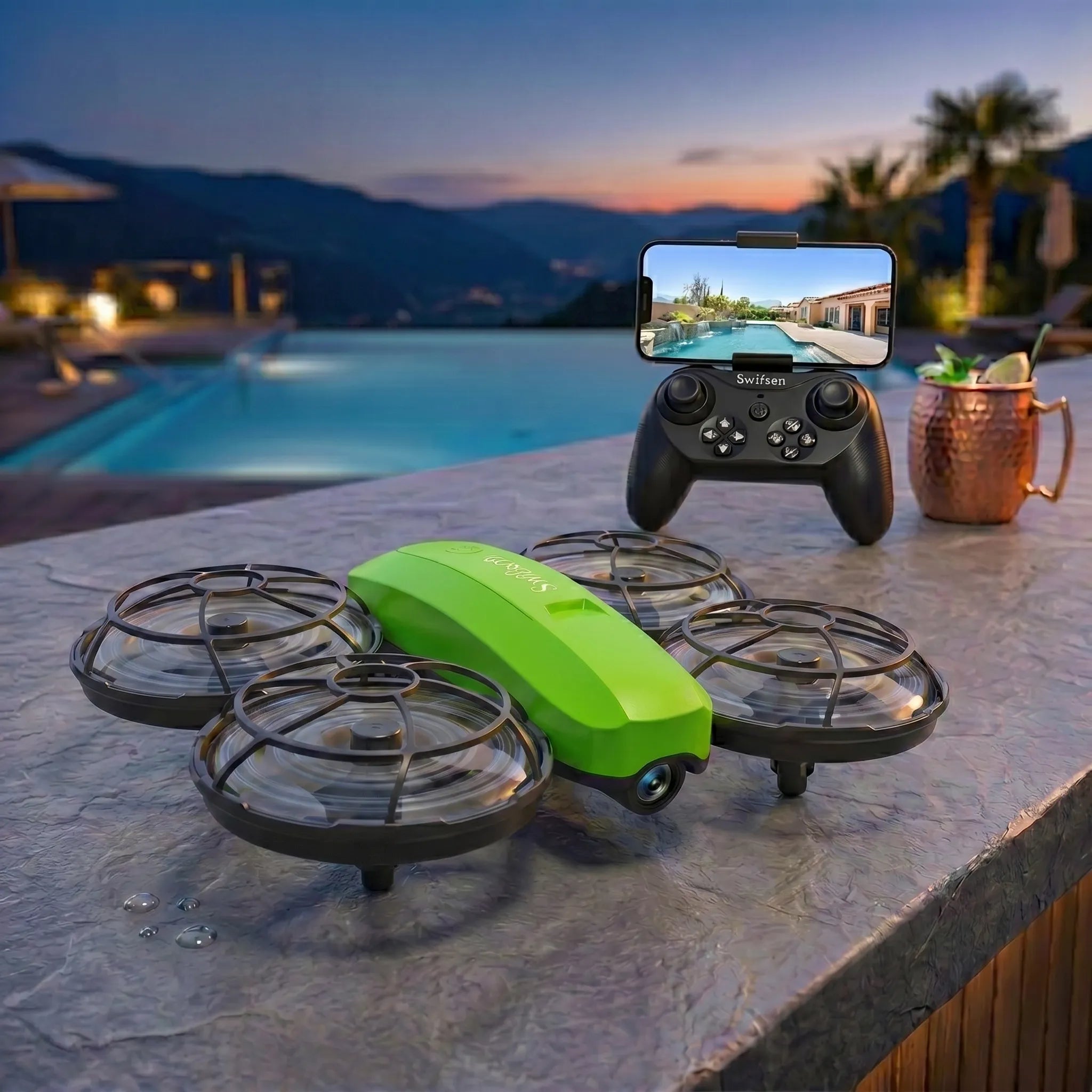 Green RC drone on a table with a controller and smartphone displaying a video feed, set against a scenic background.