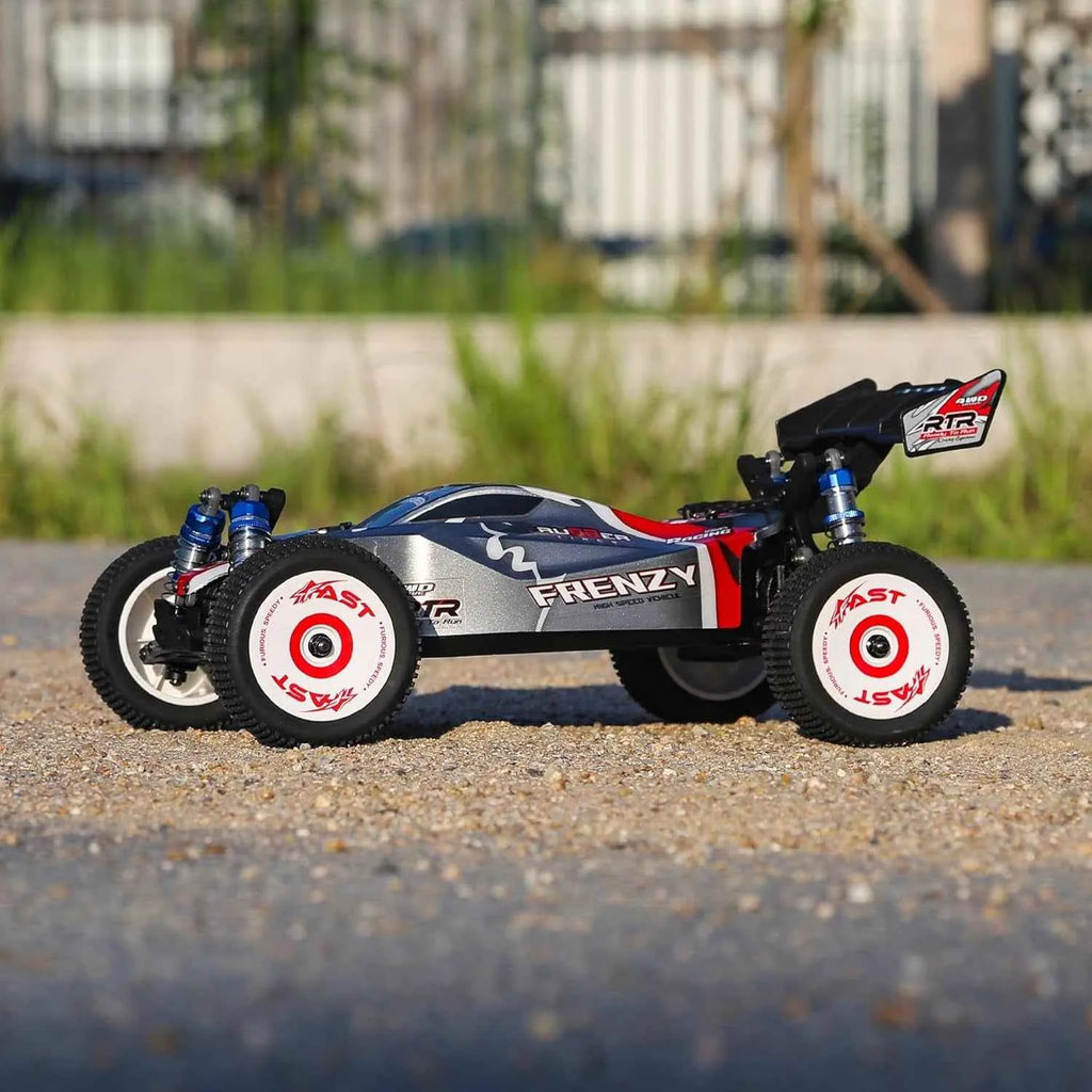 Model buggy on a gravel surface with a blurred natural background