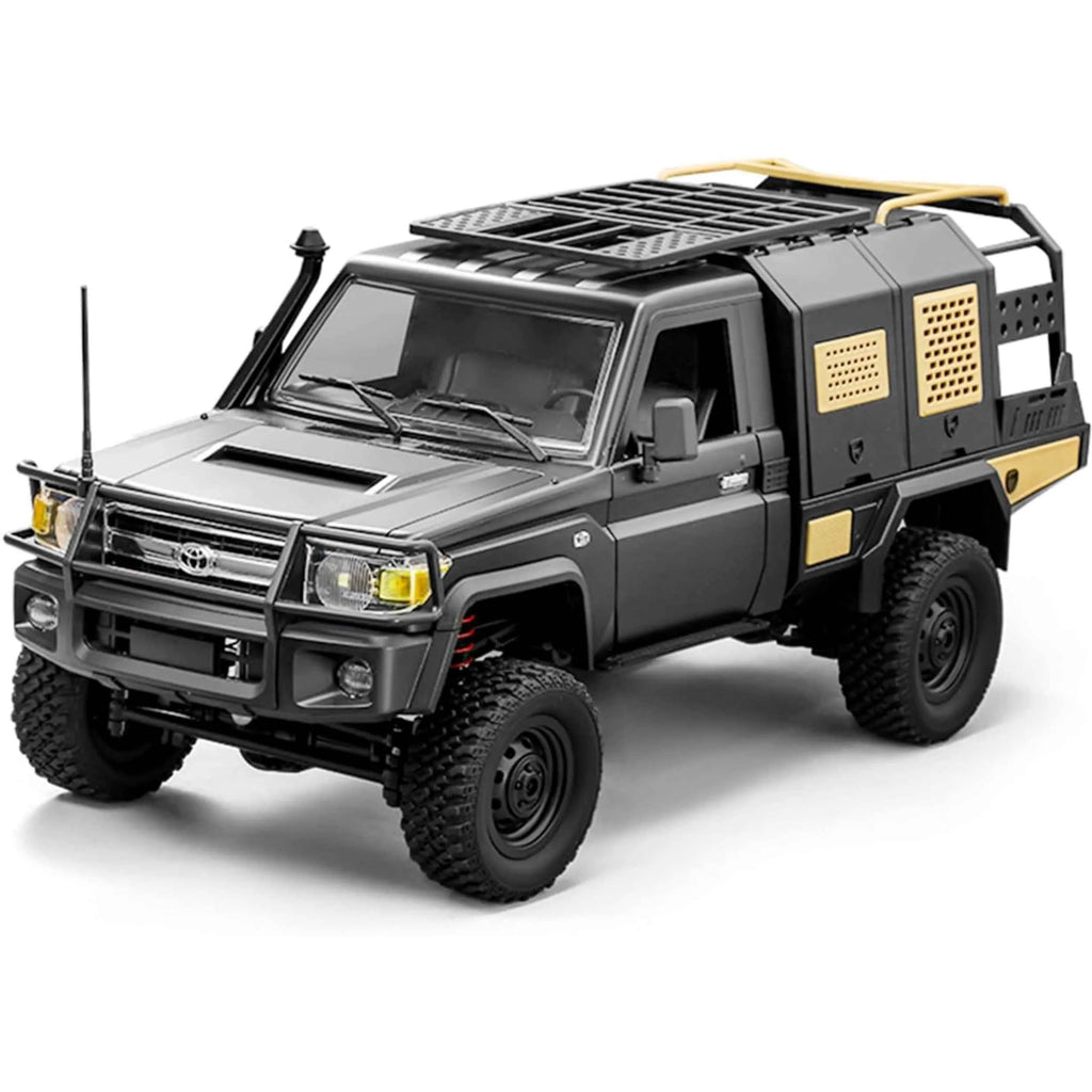 Model of a grey and gold RC crawler on a white background
