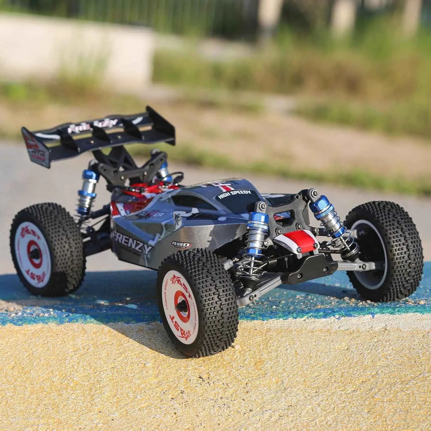 Model of a rc buggy on a track with blurred background