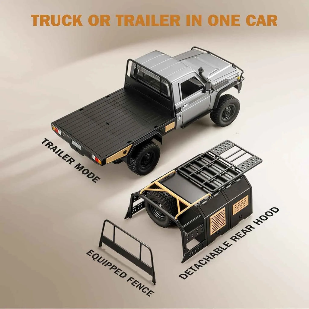 Model of a RC crawler with detachable trailer and rear hood on a beige background