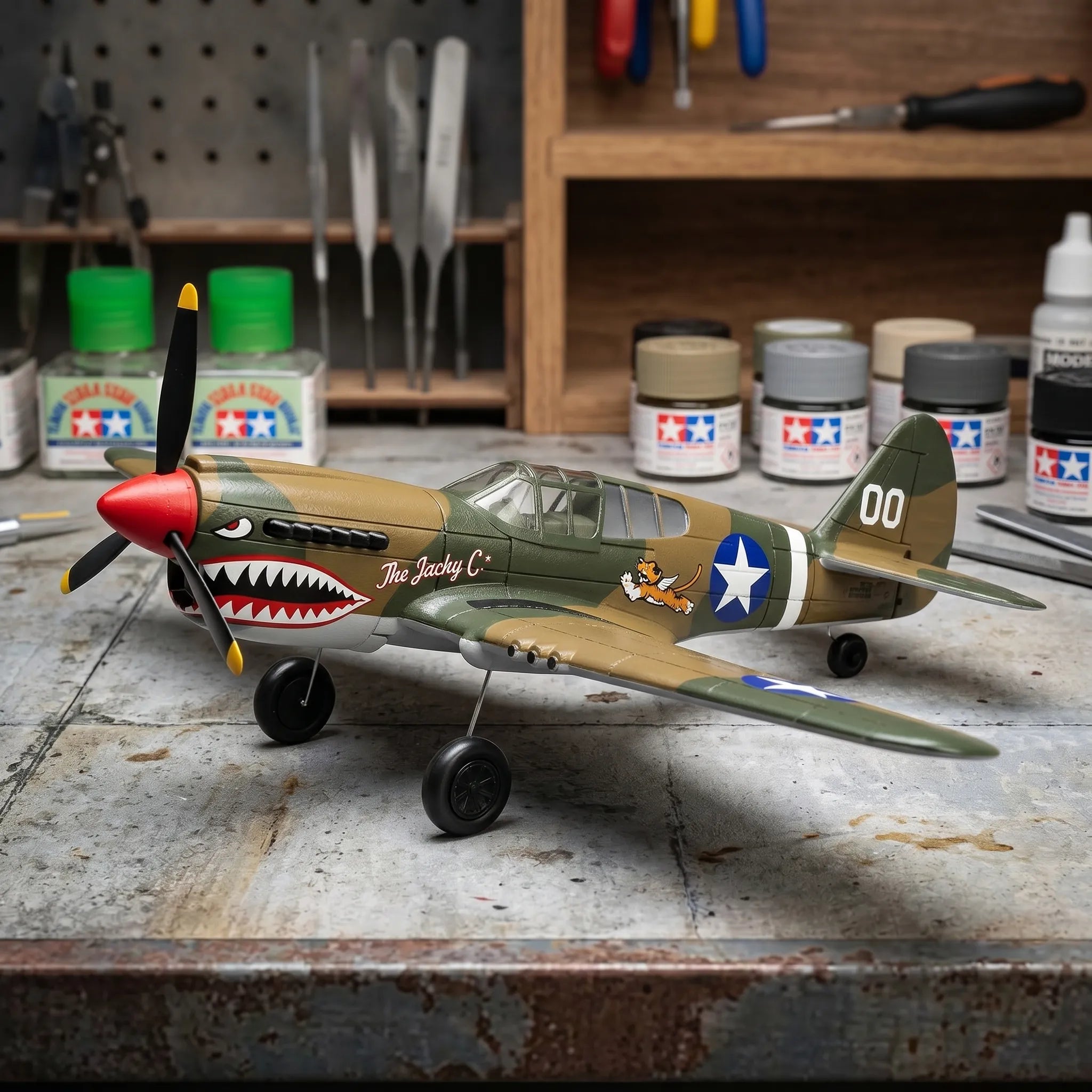 Model RC airplane on a workbench with paint cans and tools in the background