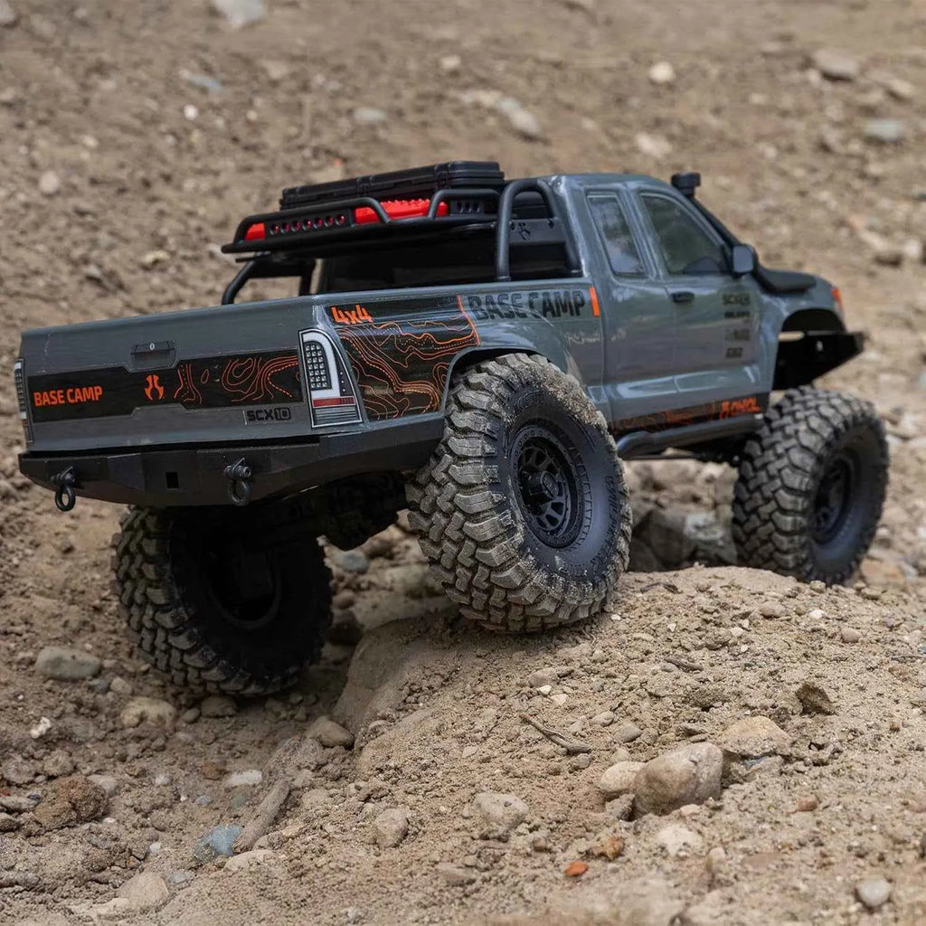 Model RC crawler with large tires on a dirt surface