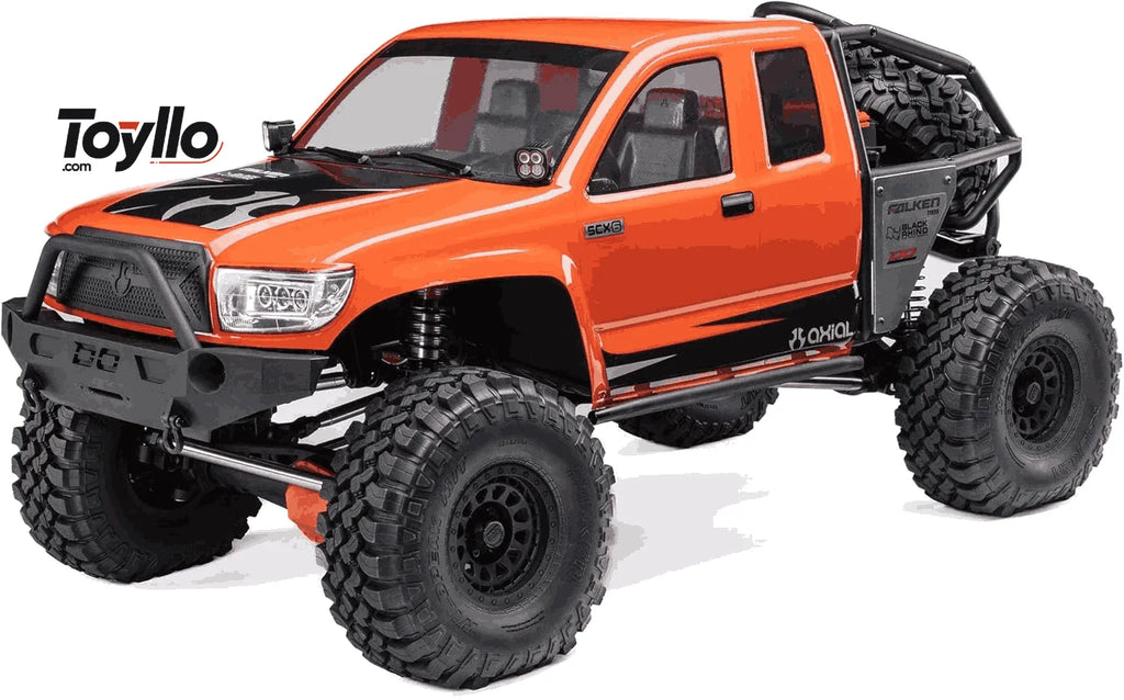 Orange RC crawler with large wheels on a white background