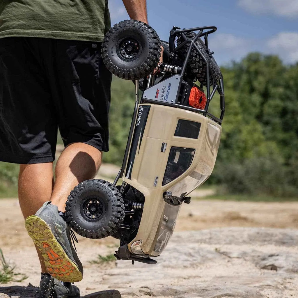 Person holding a honcho RC crawler outdoors
