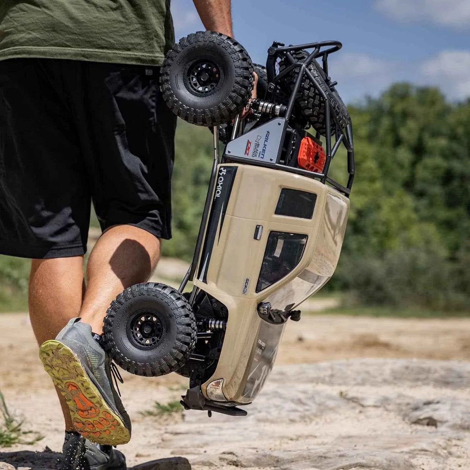 Person holding a honcho RC crawler outdoors