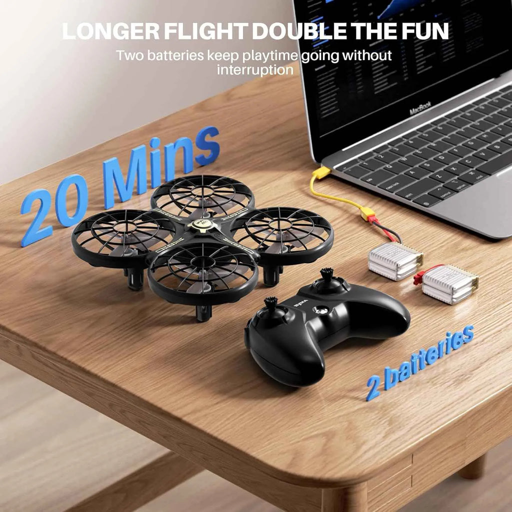 RC Drone with controller and batteries on a table next to a laptop, with text about longer flight time and battery life.