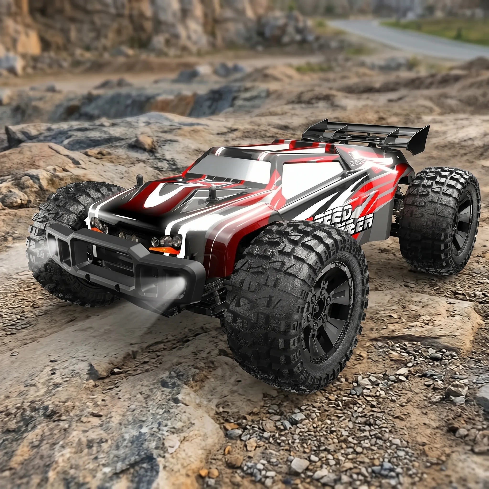 RC monster truck on a rocky terrain with mountain background