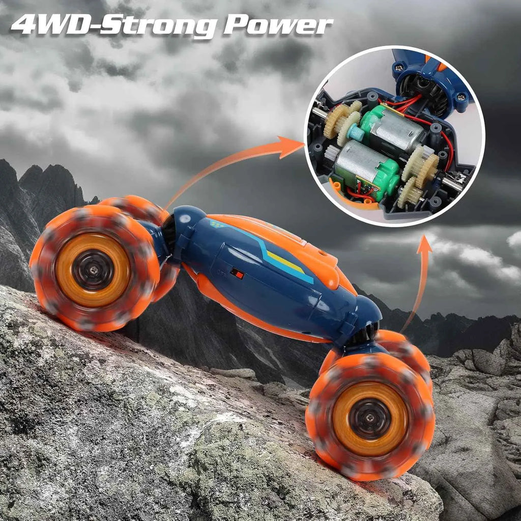 RC stunt car with 4WD system on a rocky terrain, showing detailed internal components.
