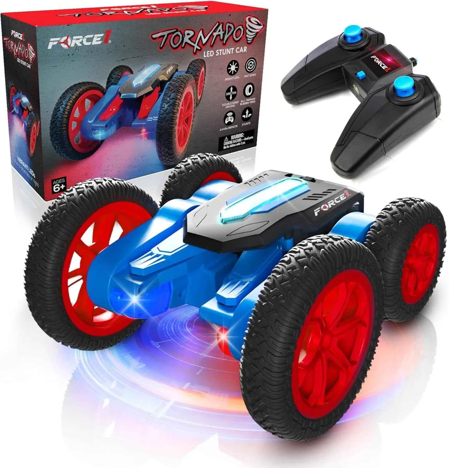 RC stunt car with red wheels and blue accents, including two remote controls, on a reflective surface with Force USA branding.