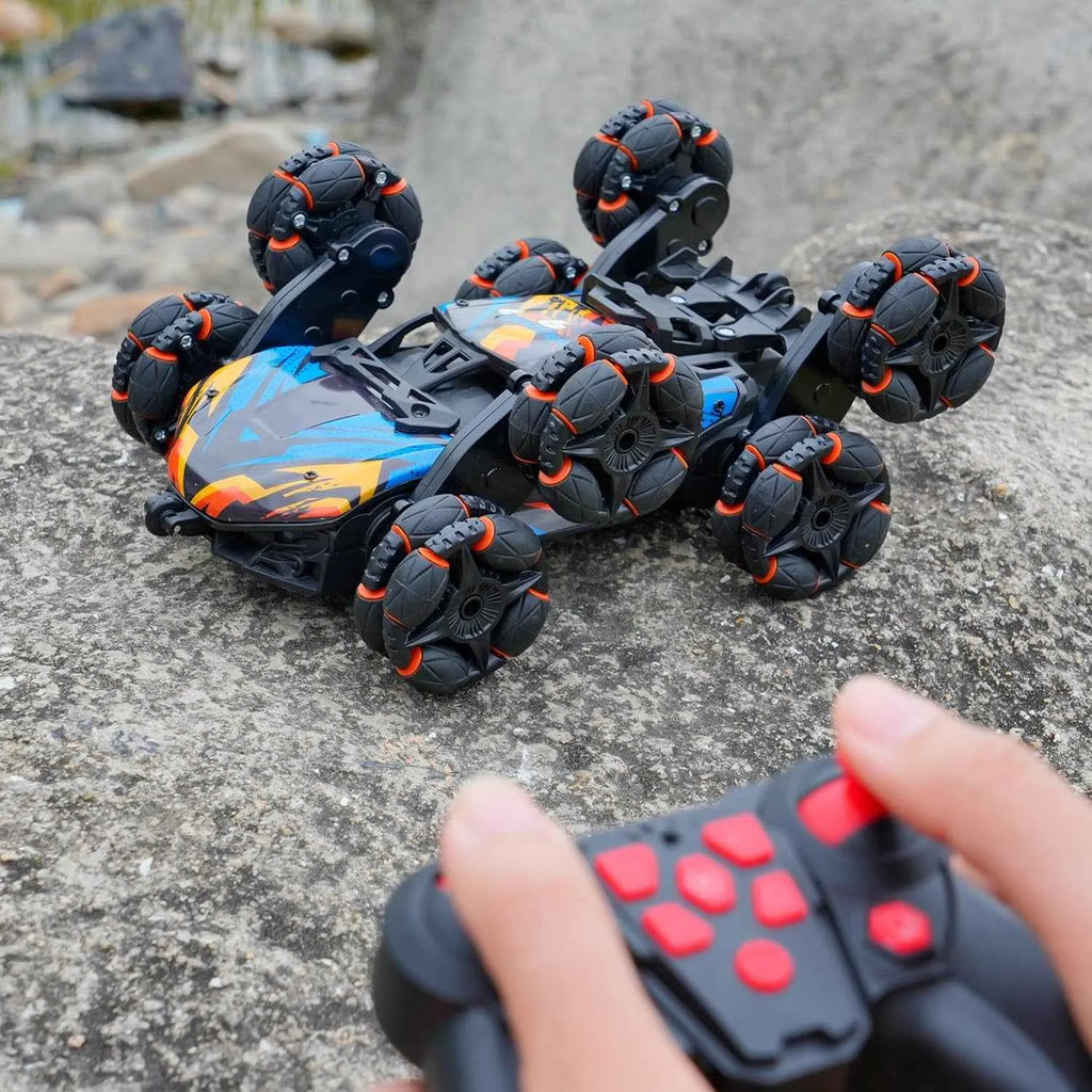 RC stunt car with remote control on a concrete surface
