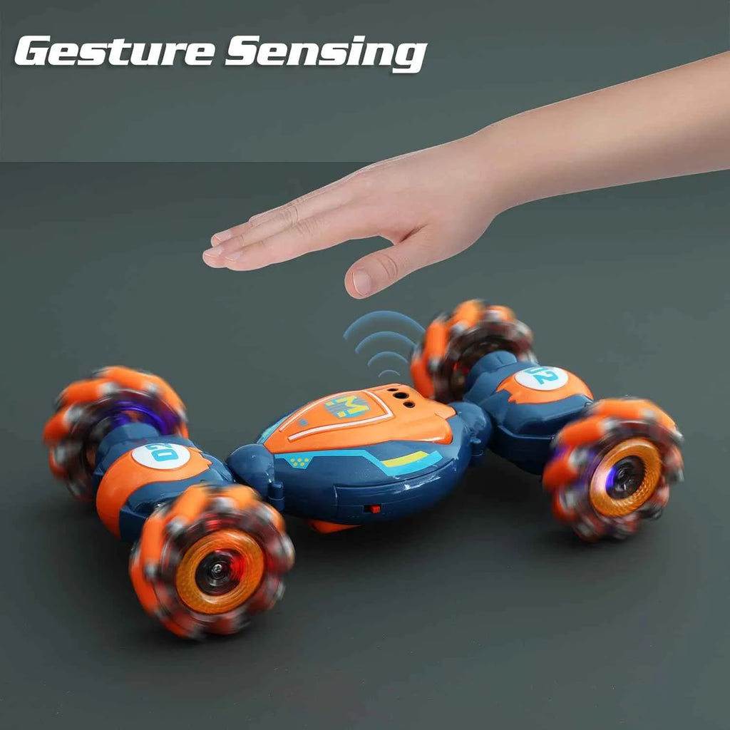 RC stunt vehicle with gesture sensing feature, hand reaching towards it on a dark background