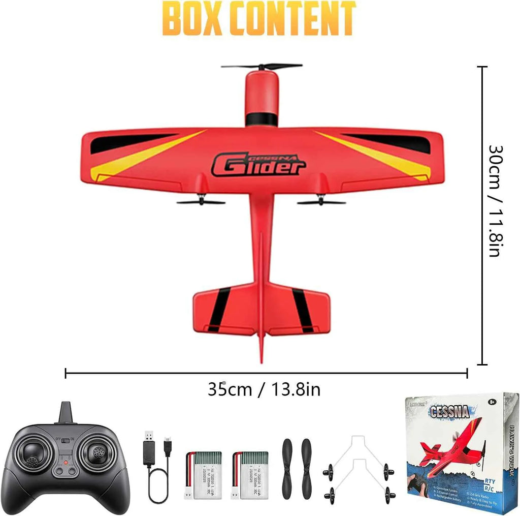 Red and yellow remote control airplane with controller and accessories on a white background