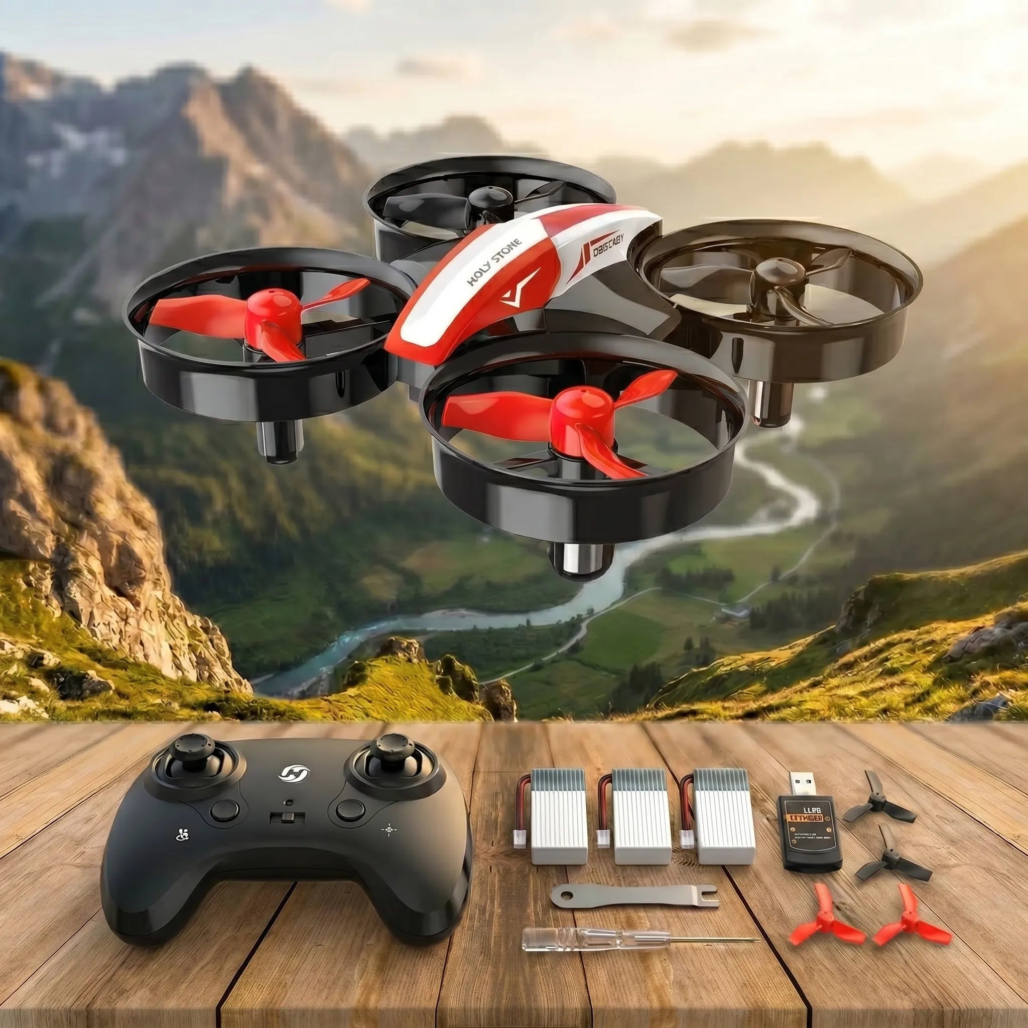 Red RC Drone with propellers, controller, and accessories on a wooden table with a mountainous landscape in the background.