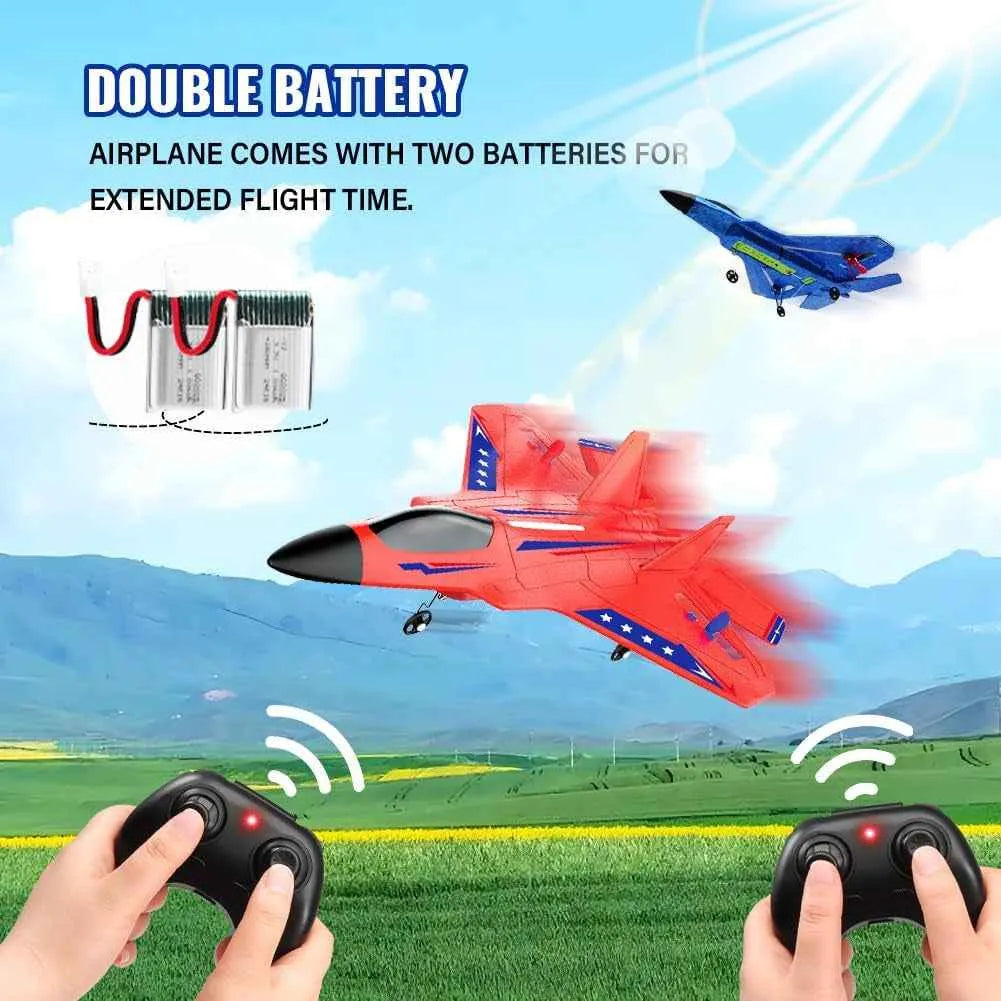 Red RC airplane with remote controls and battery pack on a scenic background