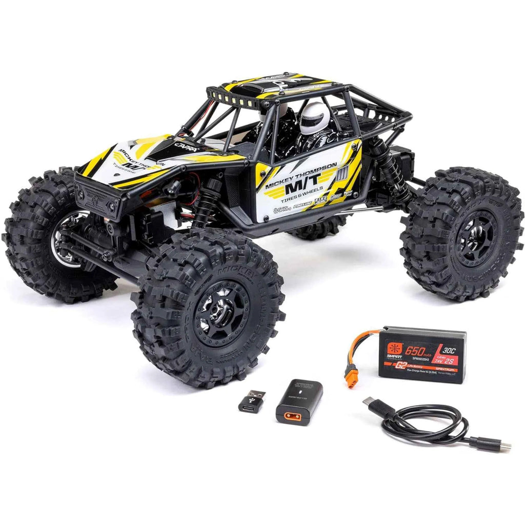Remote control rock crawler with accessories on a white background