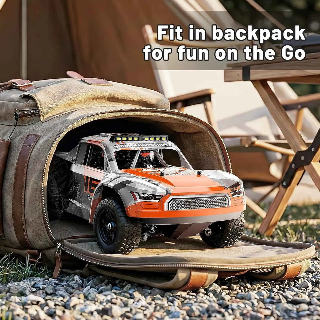 Short course truck inside a backpack with text 'Fit in backpack for fun on the Go' in an outdoor setting.