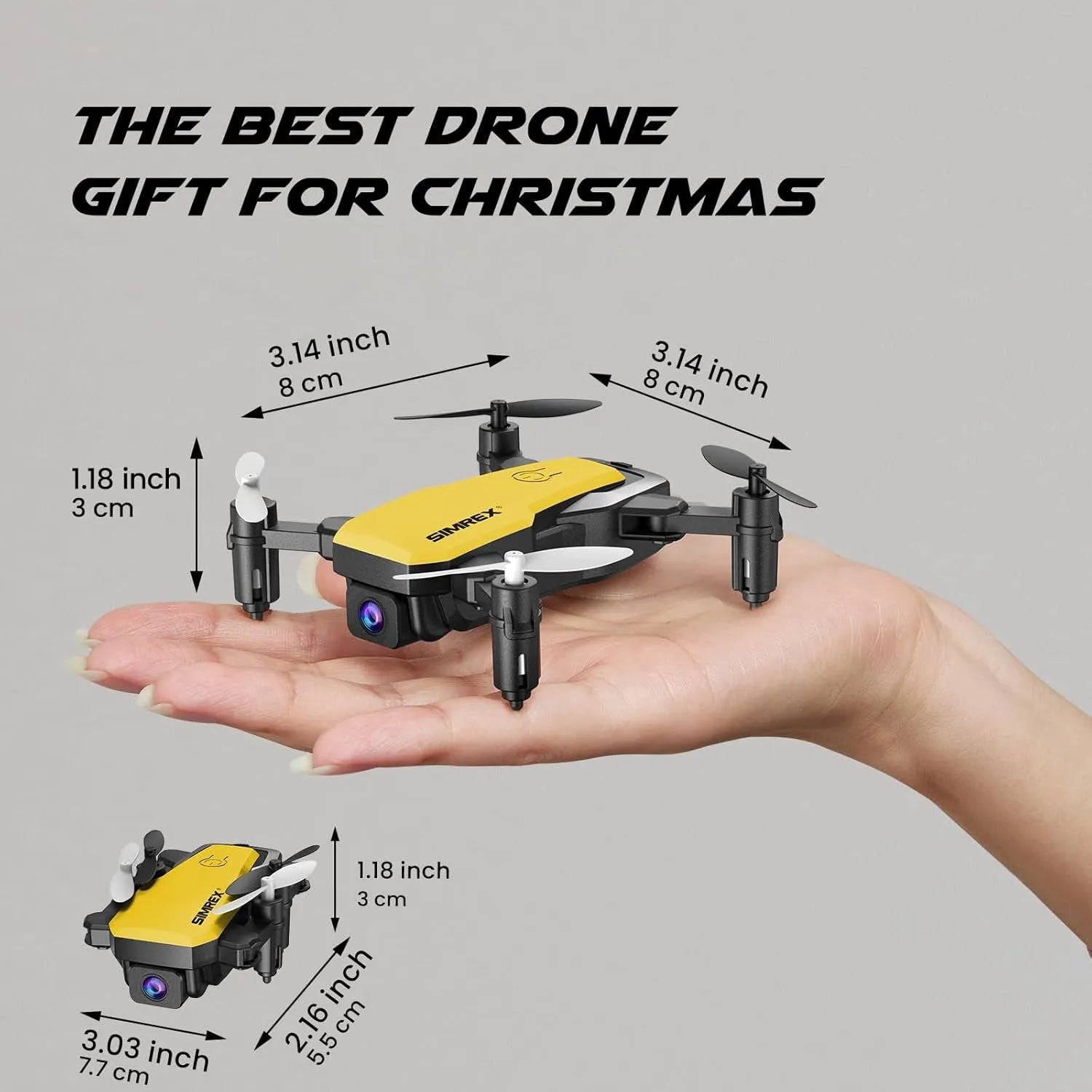 Small yellow RC drone held in a hand with measurements indicated, on a gray background.