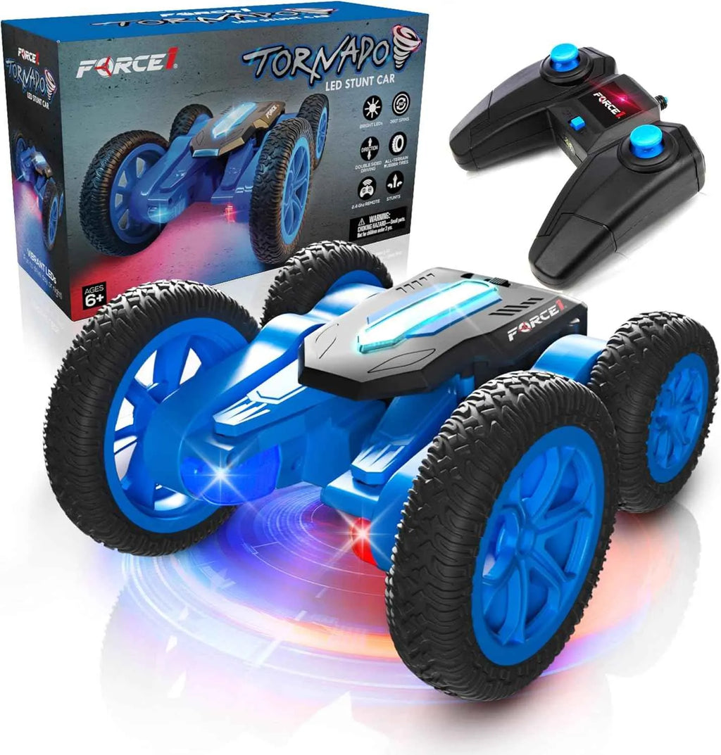 Toy RC stunt car with remote controls and packaging on a white background