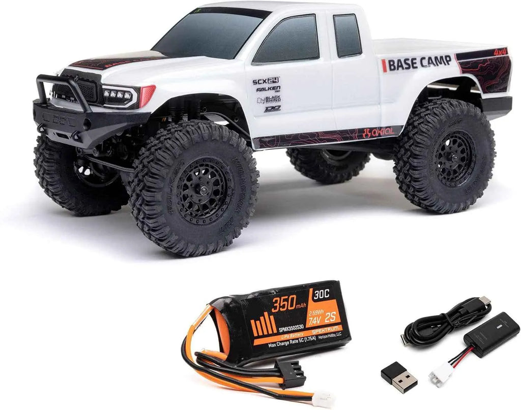 White RC crawler with battery pack and accessories on a white background